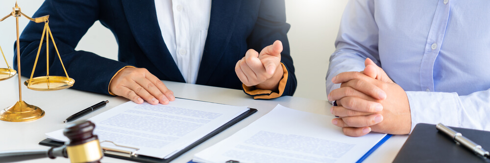 attorney reviewing documents with a client